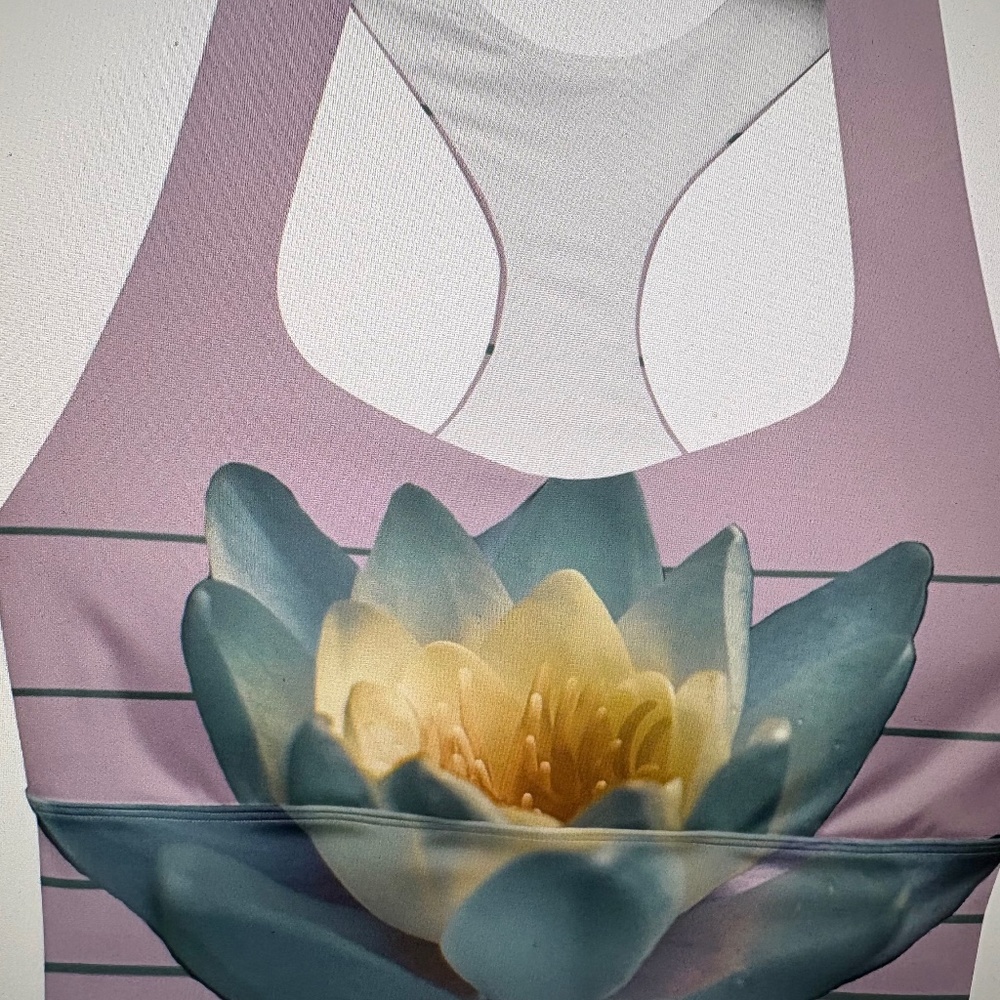 White  buffalo top and leggings in lavender with Lotus flower accents. Size L